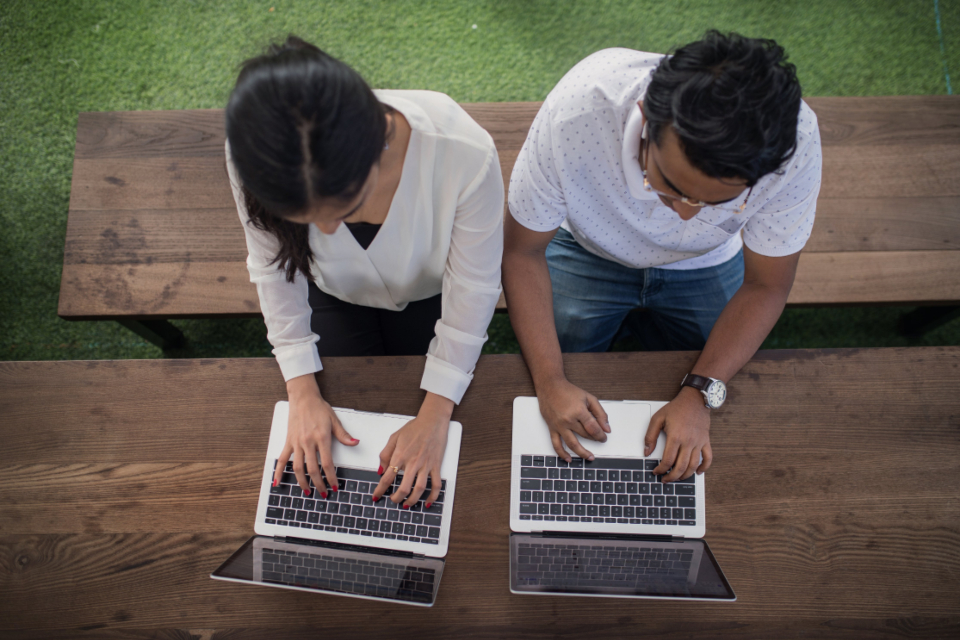 Remote worker tracking time with productivity tools and planner